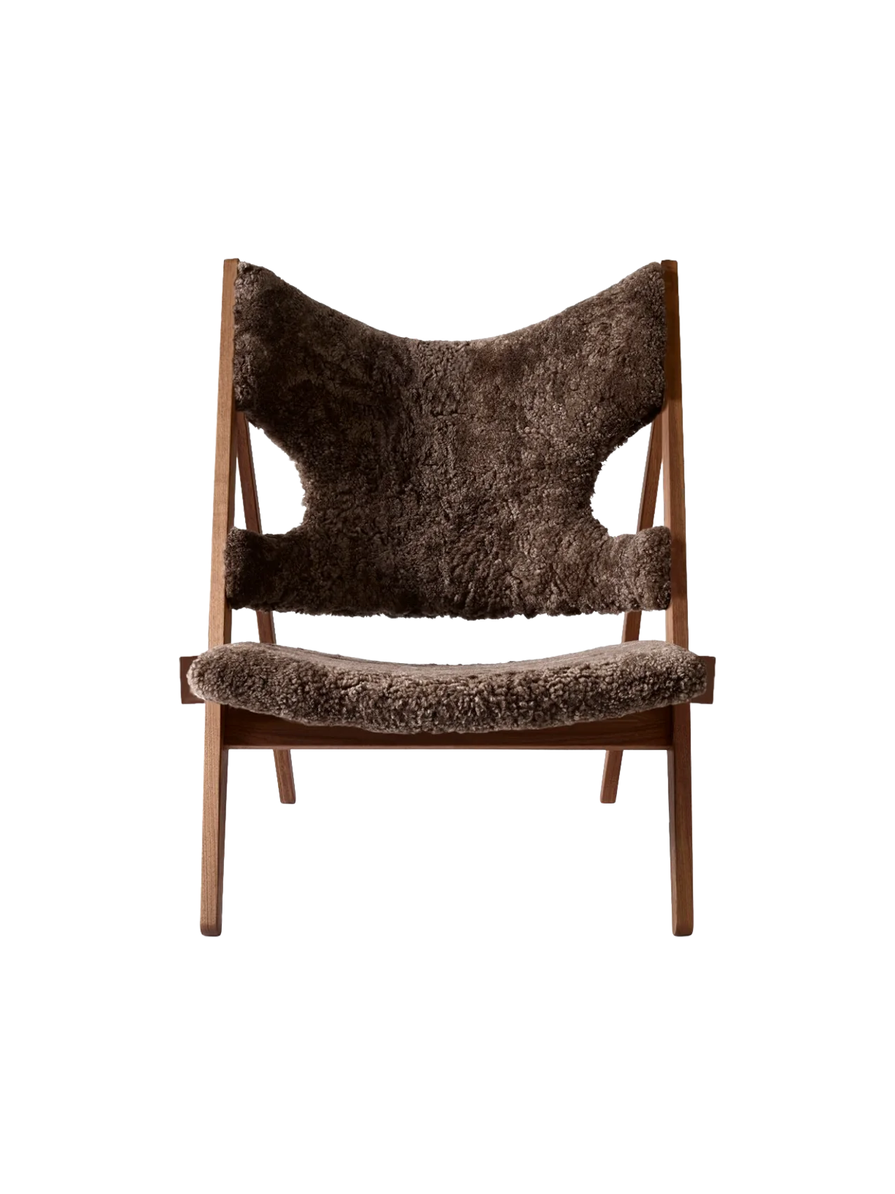 Front view of the Audo CPH Knitting Lounge Chair, featuring plush, dark brown 'Root' sheepskin upholstery on a walnut frame.