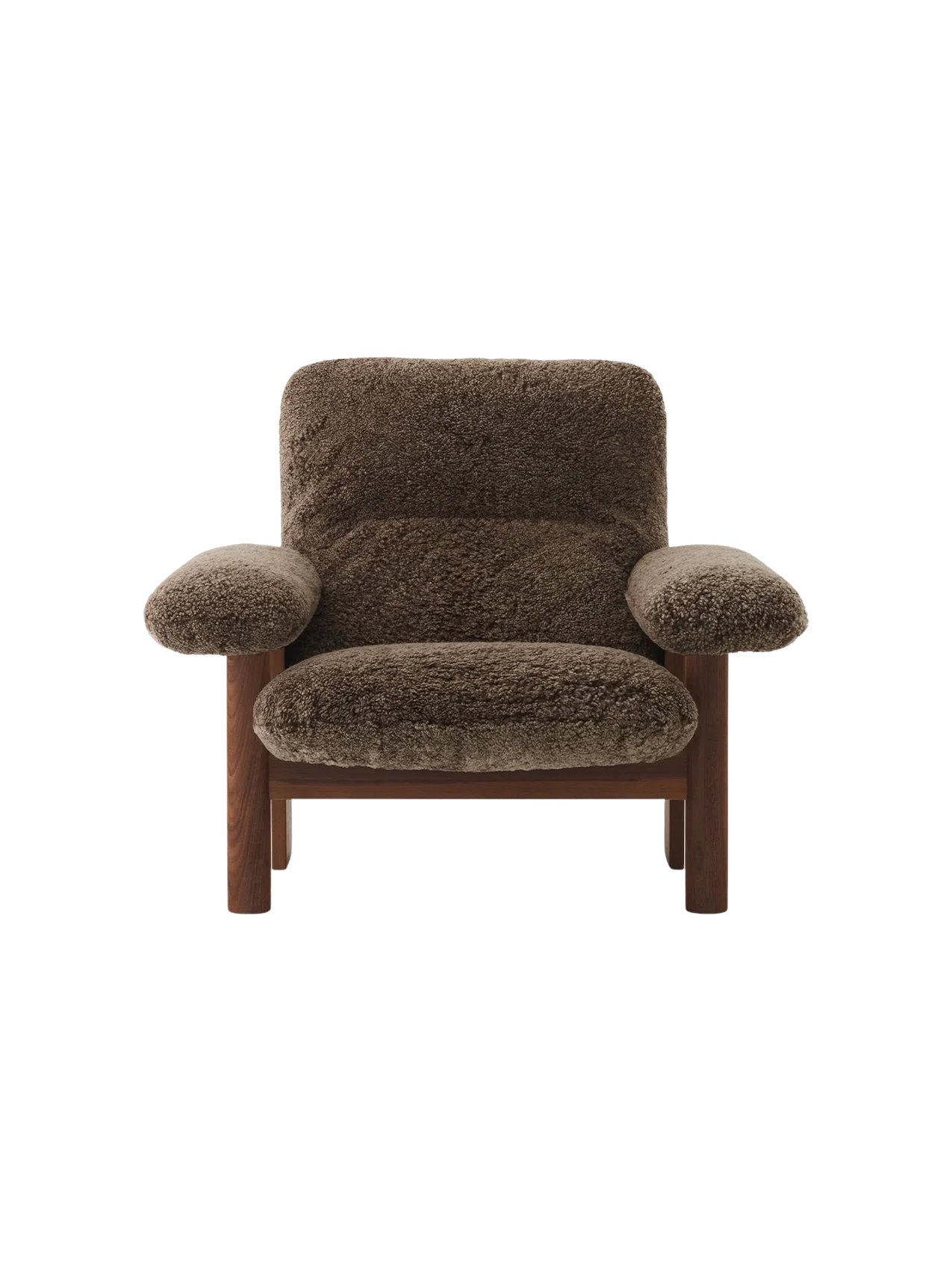 The Brasilia Lounge Chair shown from the front, featuring a dark stained oak frame and plush Root sheepskin upholstery.