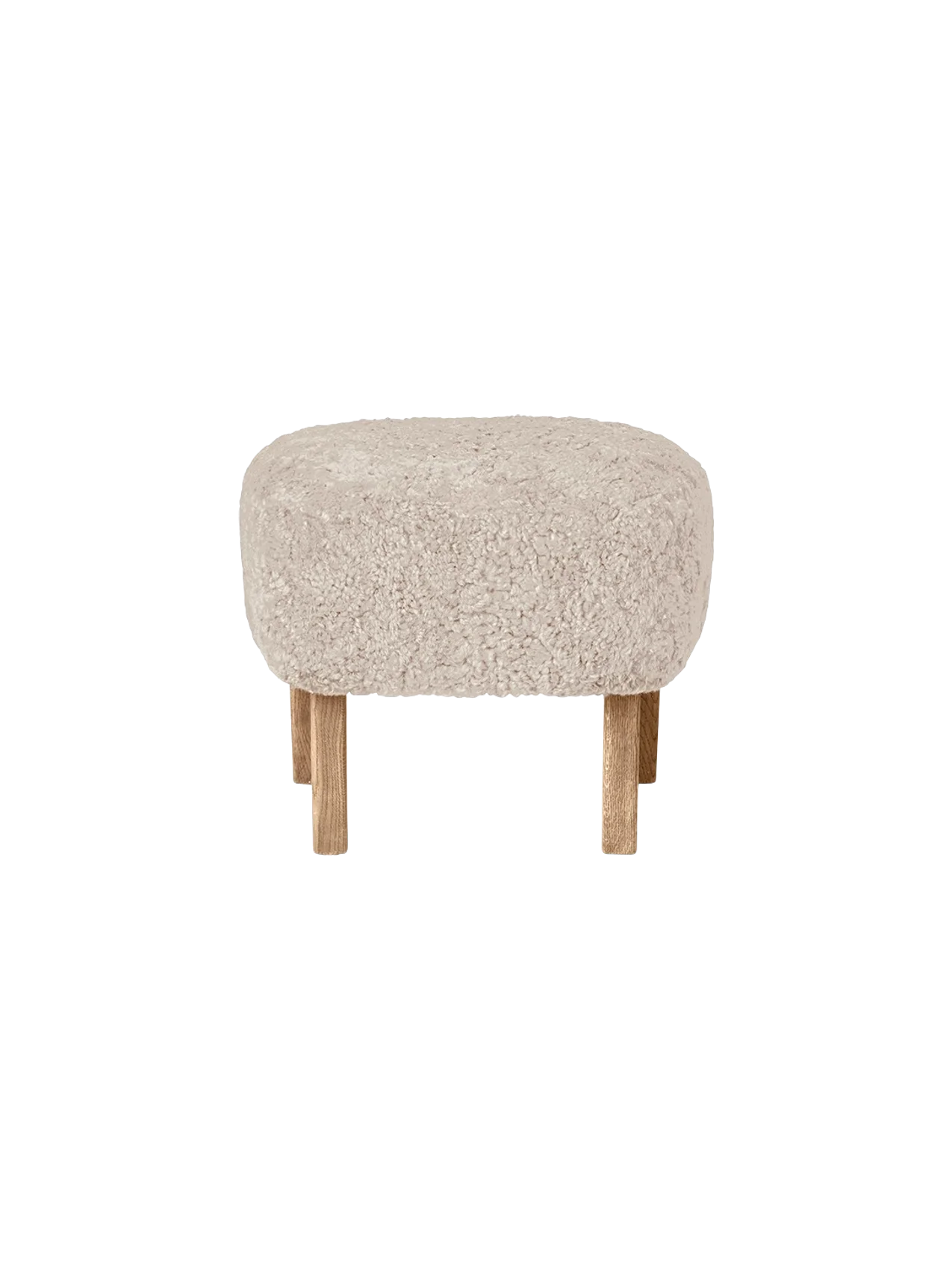 Front view of the Ingeborg Ottoman, upholstered in fluffy off-white Sheepskin Moonlight, with four short natural oak legs.