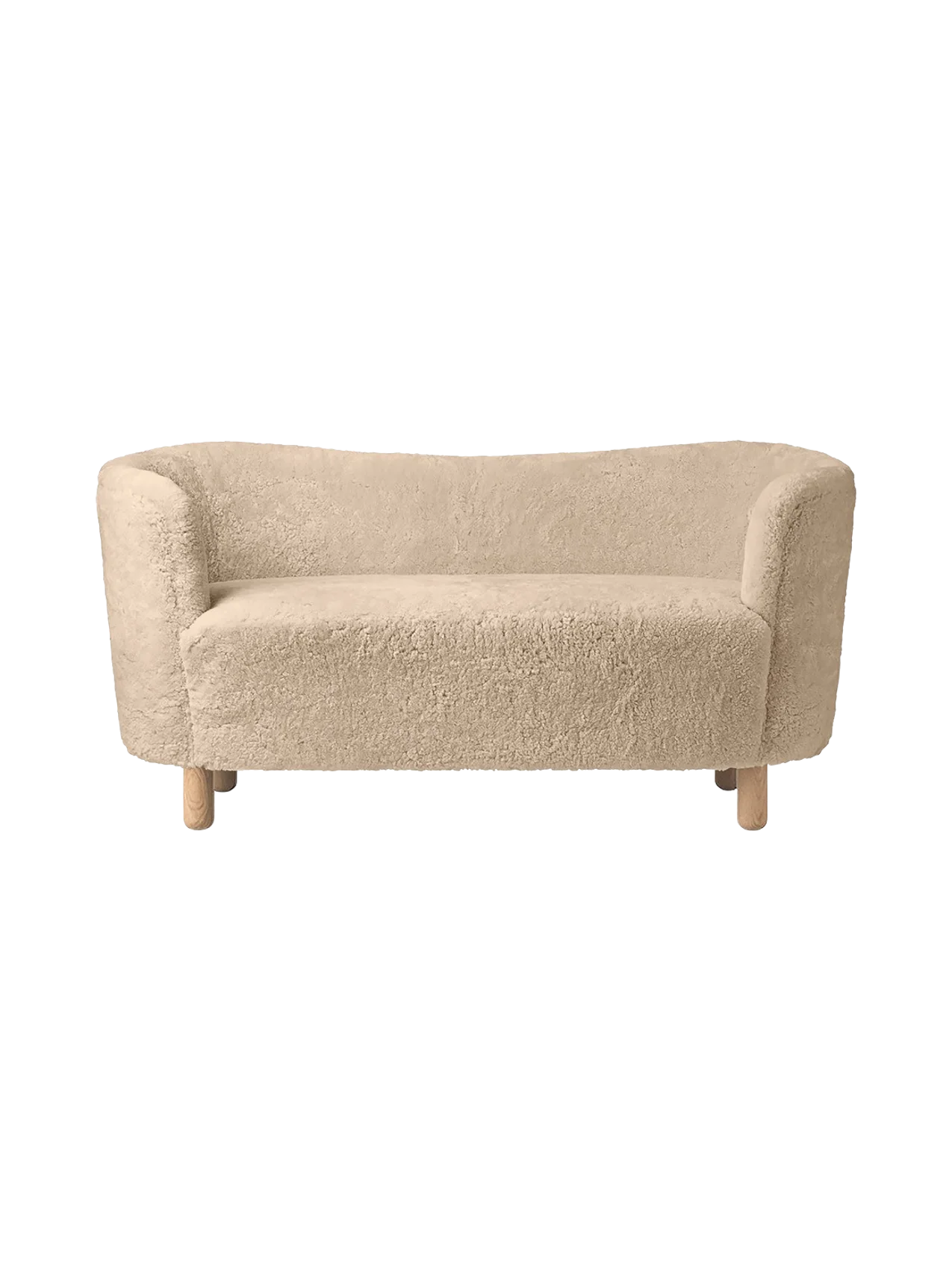 Front view of the Mingle Sofa in honey sheepskin. The compact two-seater has curved arms and rests on four natural oak legs.