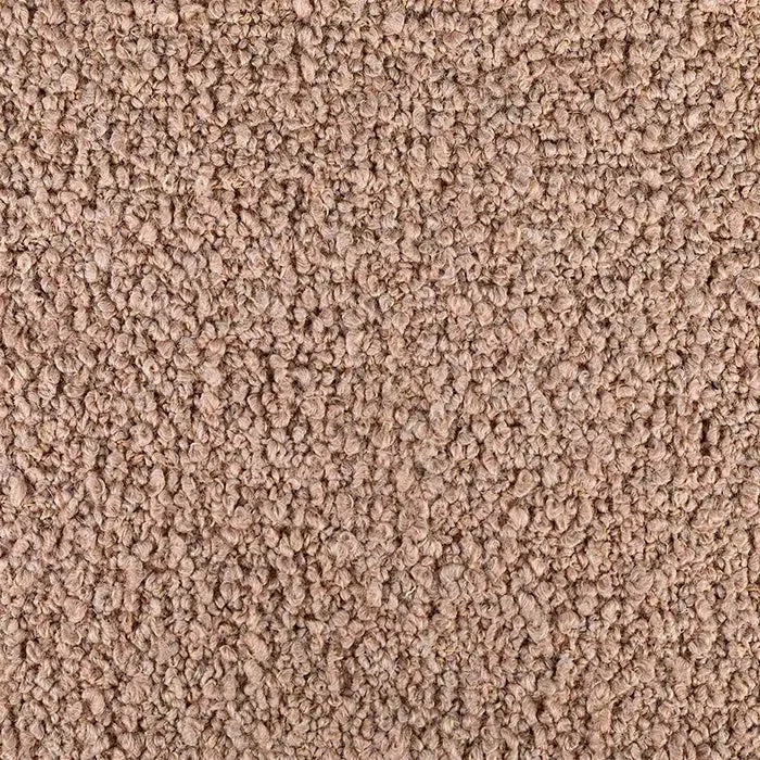 Close-up of beige looped wool carpet texture with dense, curly pile and soft natural fibres.