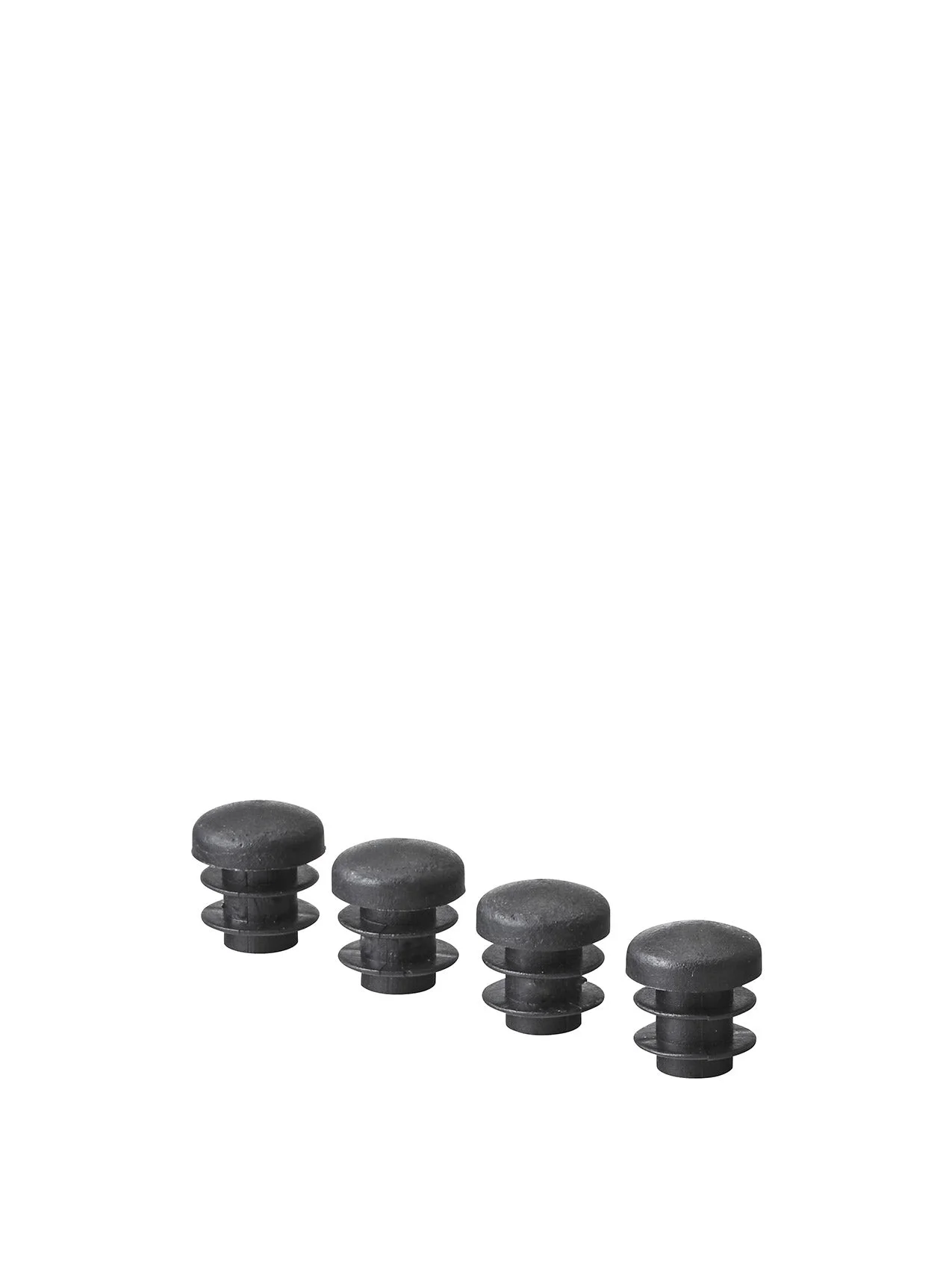 Four black plastic ribbed inserts for furniture legs, shown in a row against a plain white background.