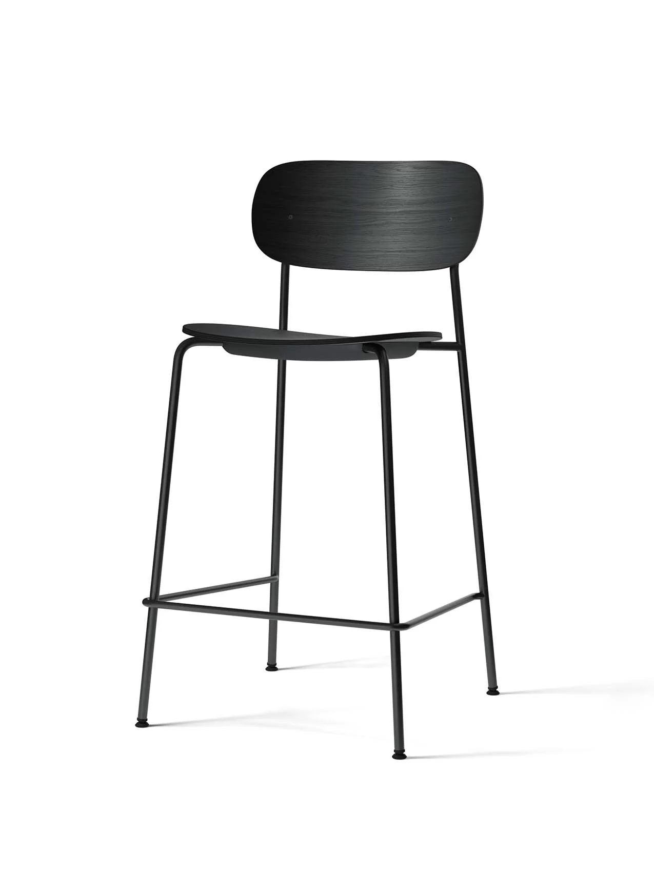 A black Co Counter Chair with a black oak veneer seat and backrest, set on a slim, tubular black steel frame with a footrest.