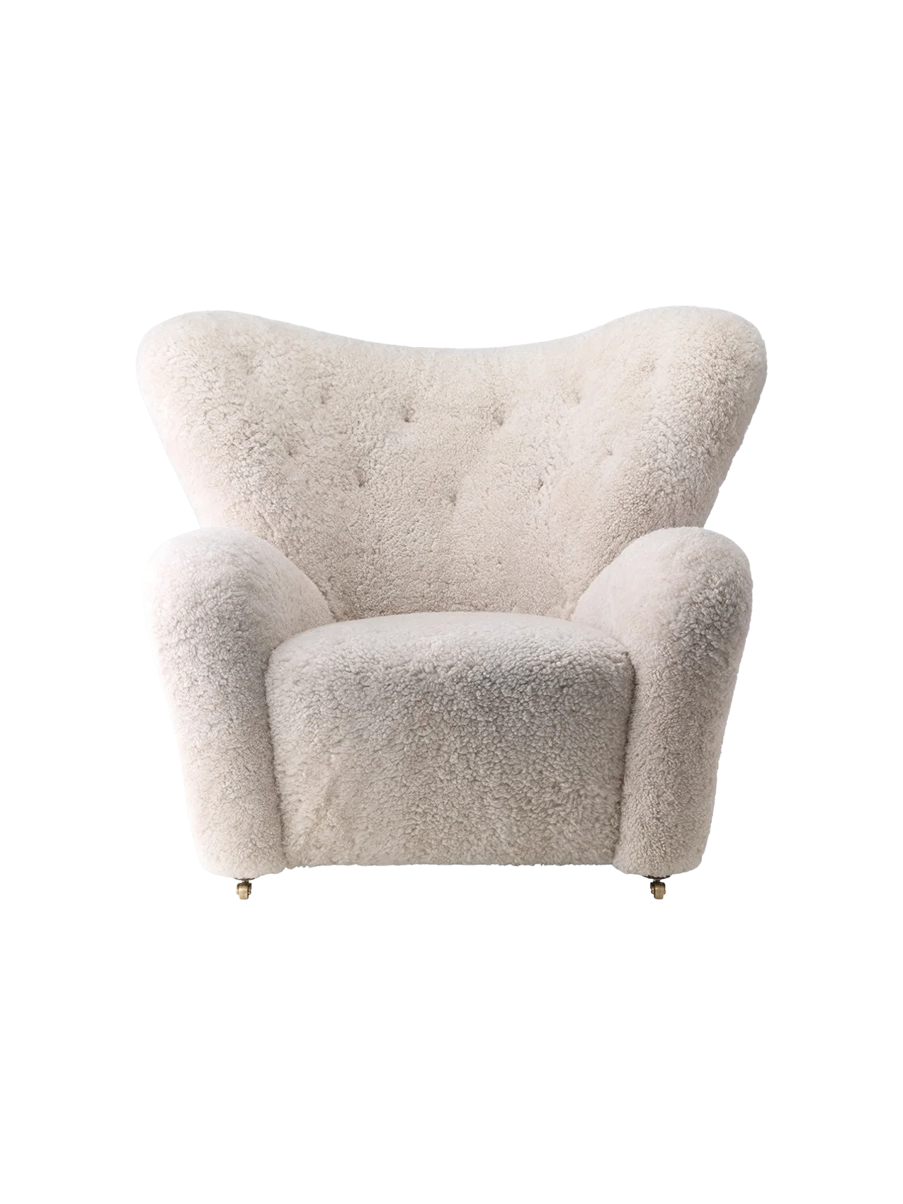 Front view of The Tired Man Lounge Chair upholstered in plush, off-white sheepskin, with a high, curved, button-tufted back.