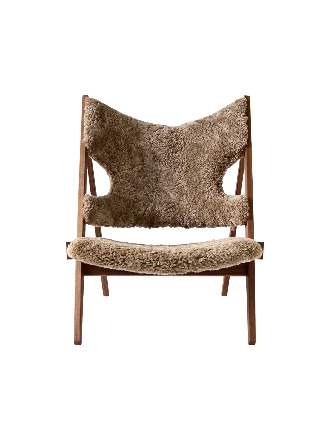 Front view of the Knitting Lounge Chair. The chair has a dark walnut frame and is upholstered in brown sheepskin.