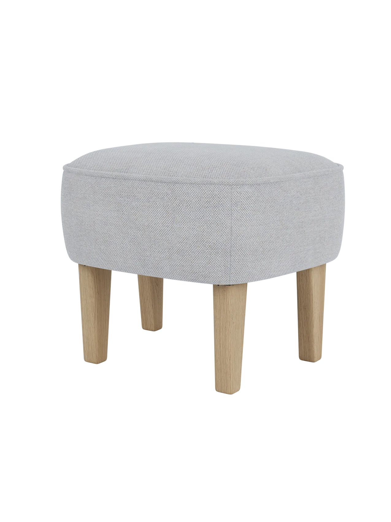The Ingeborg Ottoman viewed from a three-quarter angle, upholstered in light grey Fiord 751 with natural oak legs.