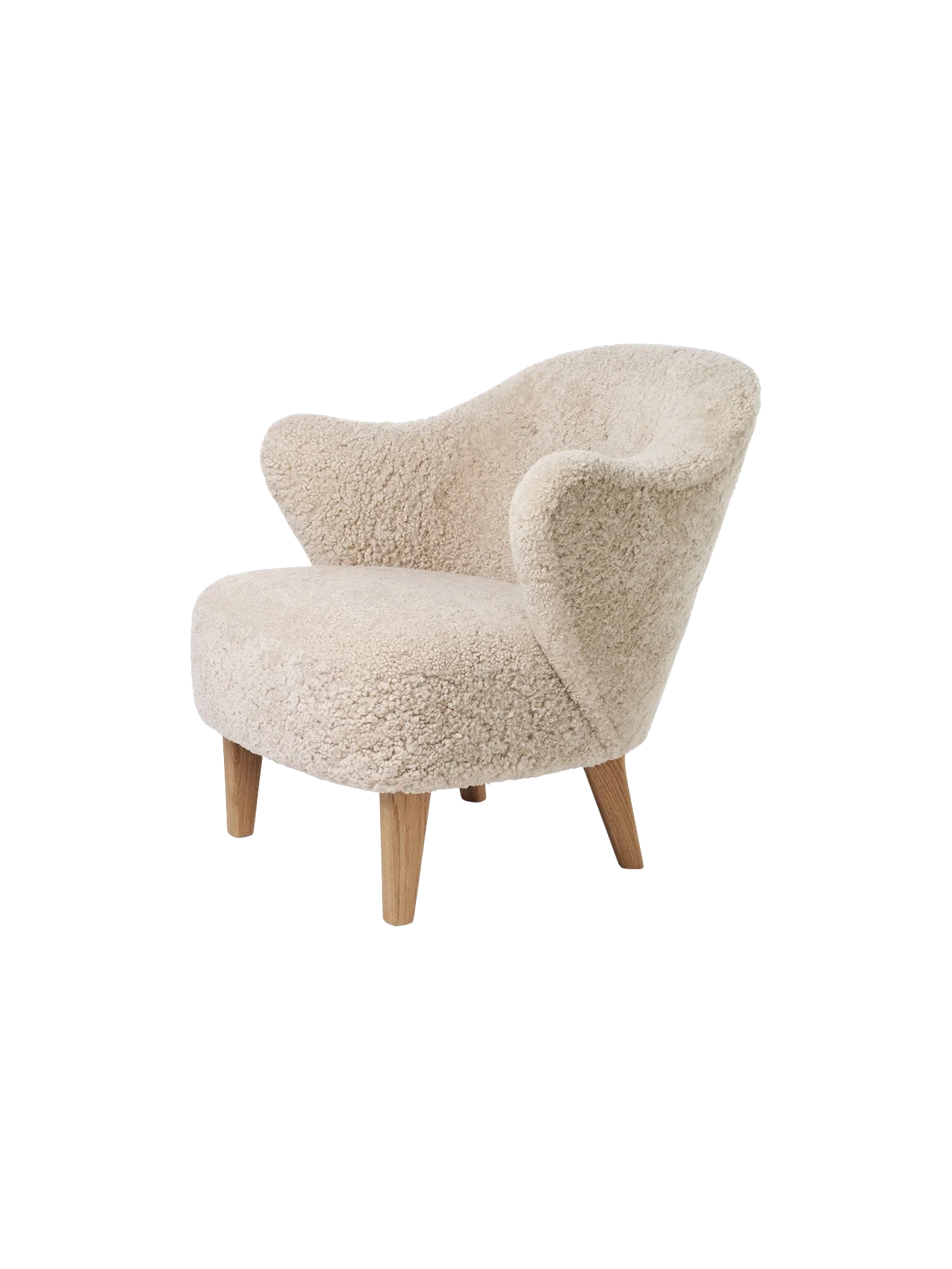 A three-quarter view of the Ingeborg Lounge Chair in fluffy, off-white Sheepskin Moonlight with four angled natural oak legs.