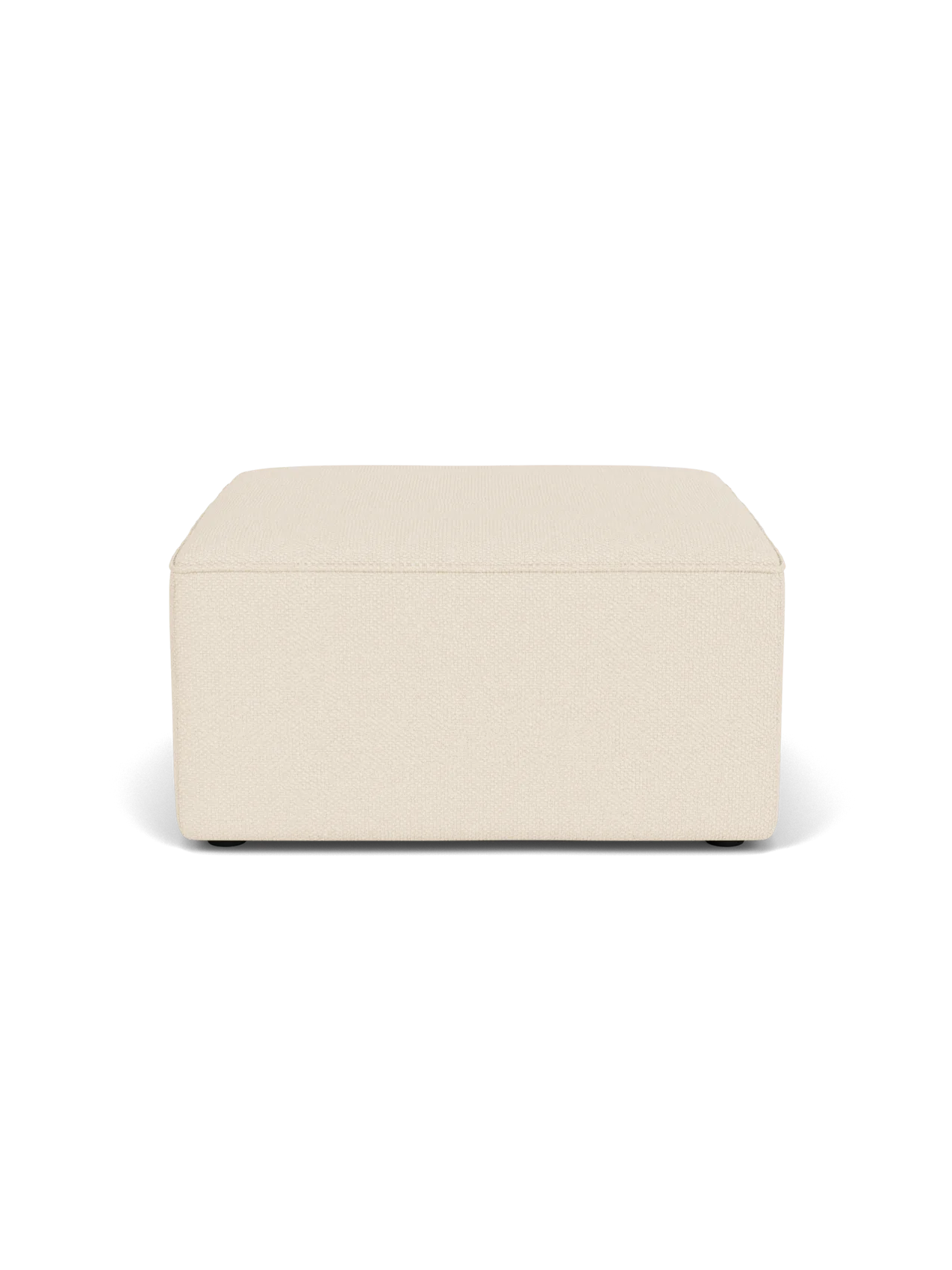 Eave Modular Pouf, 75, a square ottoman upholstered in a textured, light beige Logan Jasmine fabric on a black background